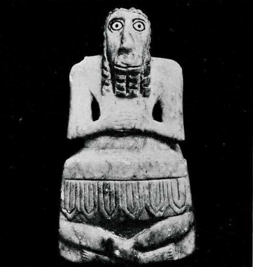 The head of a human statuette, bald with a unibrow