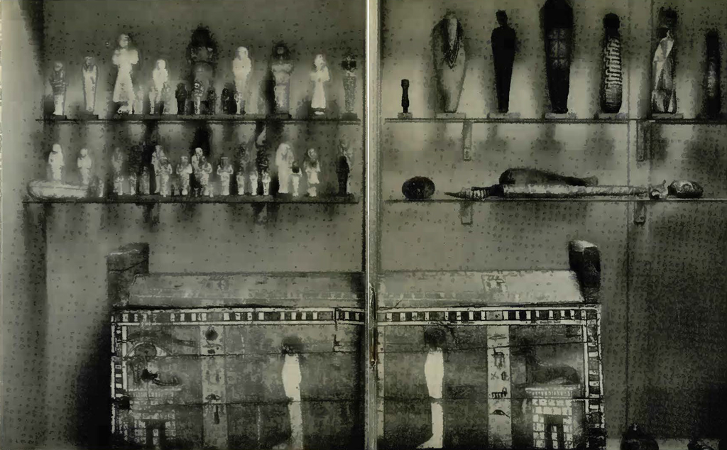 A rectangular decorated coffin box and a display of funerary items and figurines