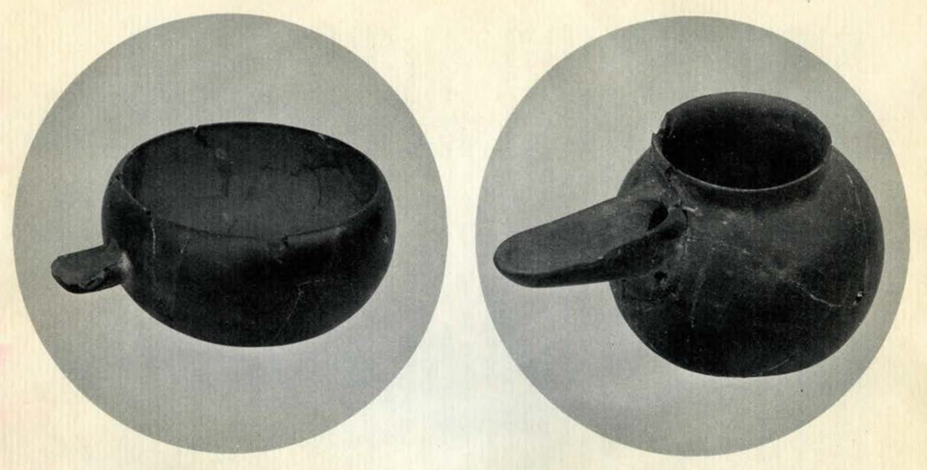 Two round obsidian vessels, both with spouts