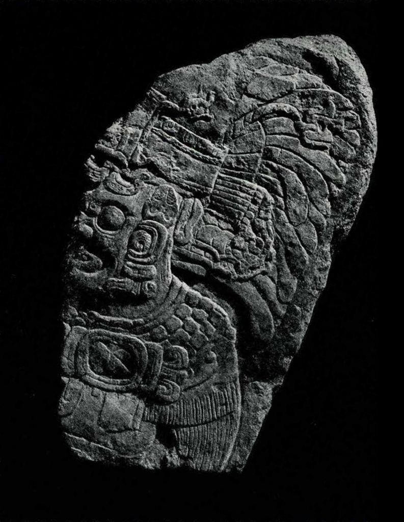 Stone fragment showing a Maya God from the waist up with an elaborate headdress