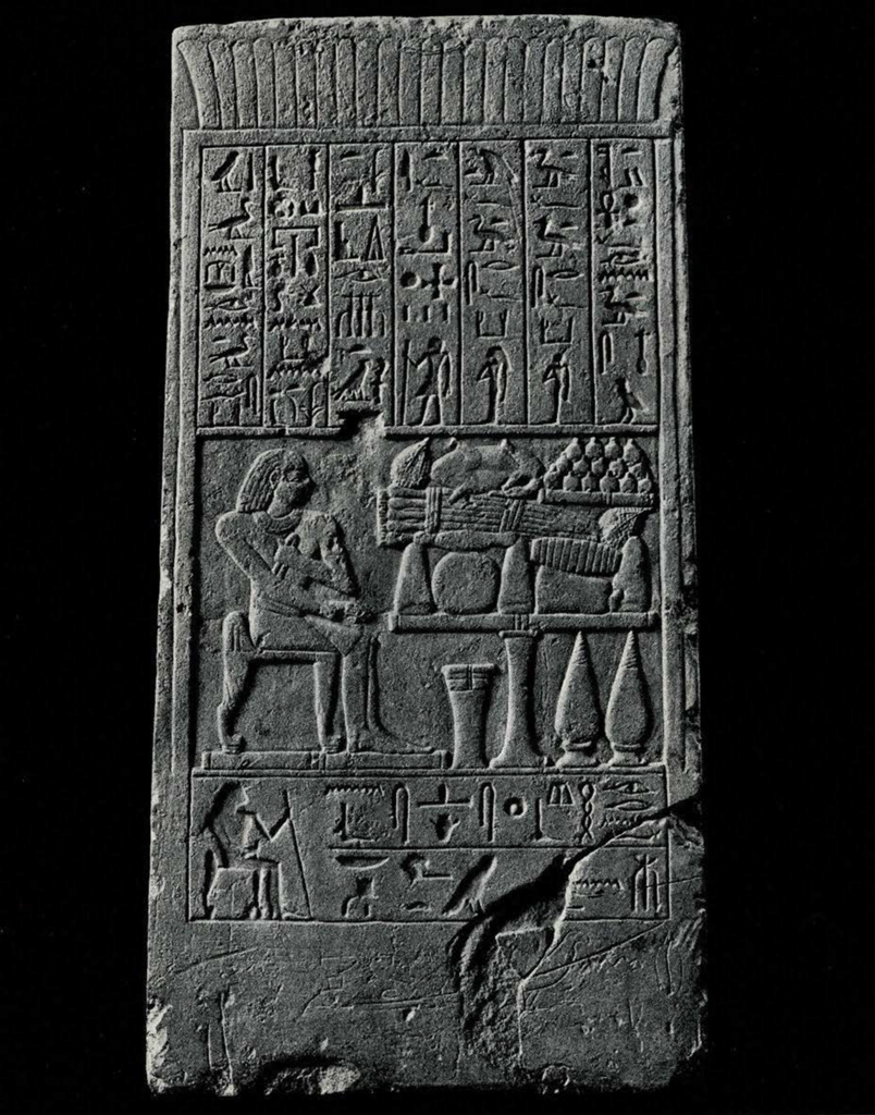 Four sided stela of the purification priest Sasopedu-iienhab. All four sides and the top are inscribed and traces of grafitti and paint remain. 