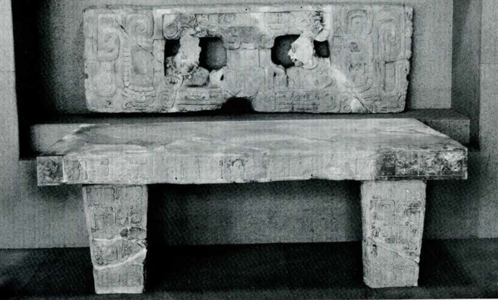 A carved stone throne in a bench shape
