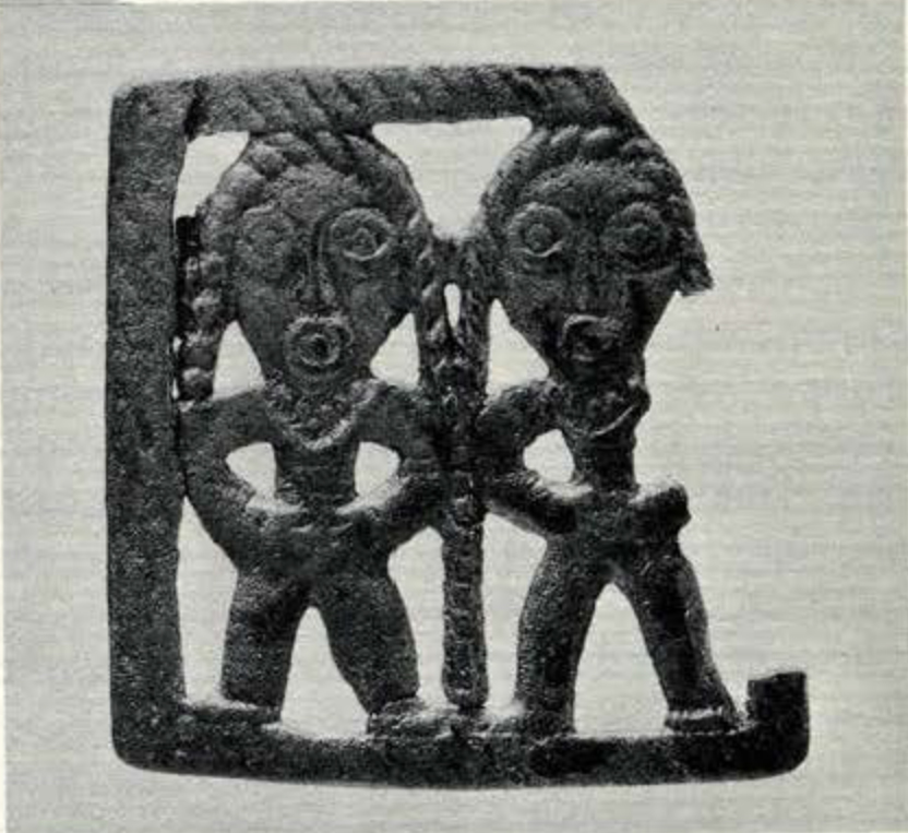 Small bronze pieces depicting two figures with long braided hair
