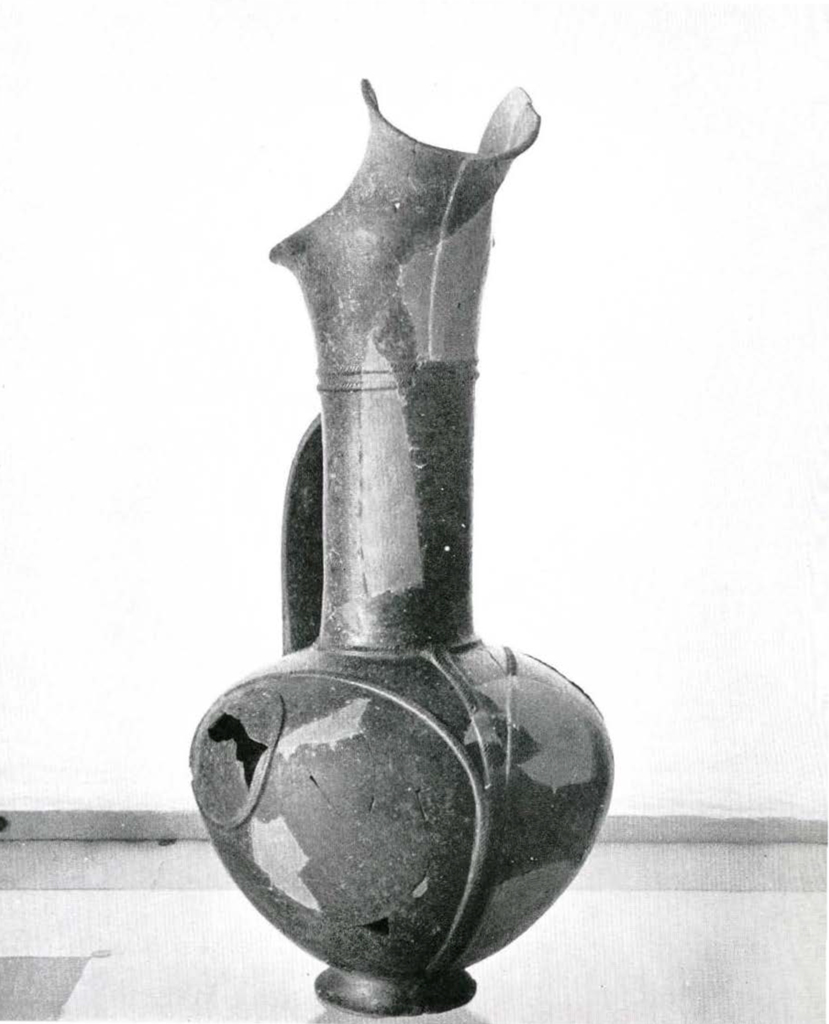 Pitcher with tall neck and spherical body, fragments missing