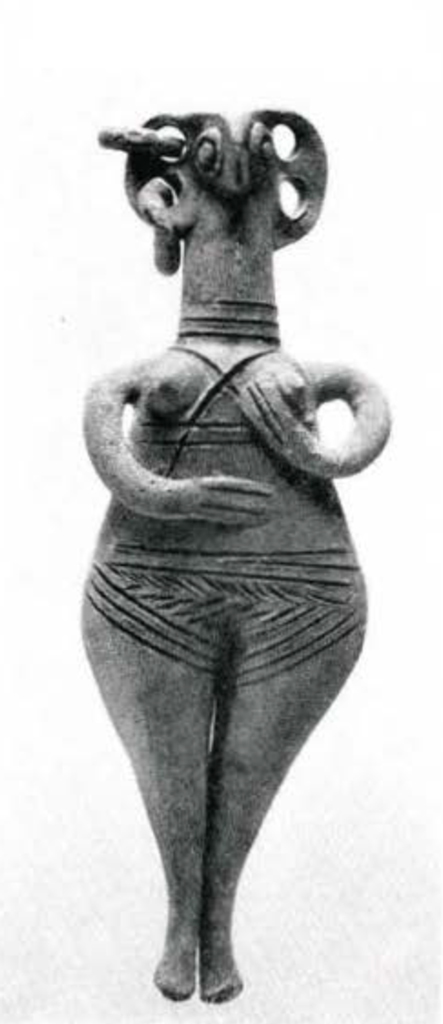 A figurine of a person with wide hips and arms clutching their boyd, head of an animal