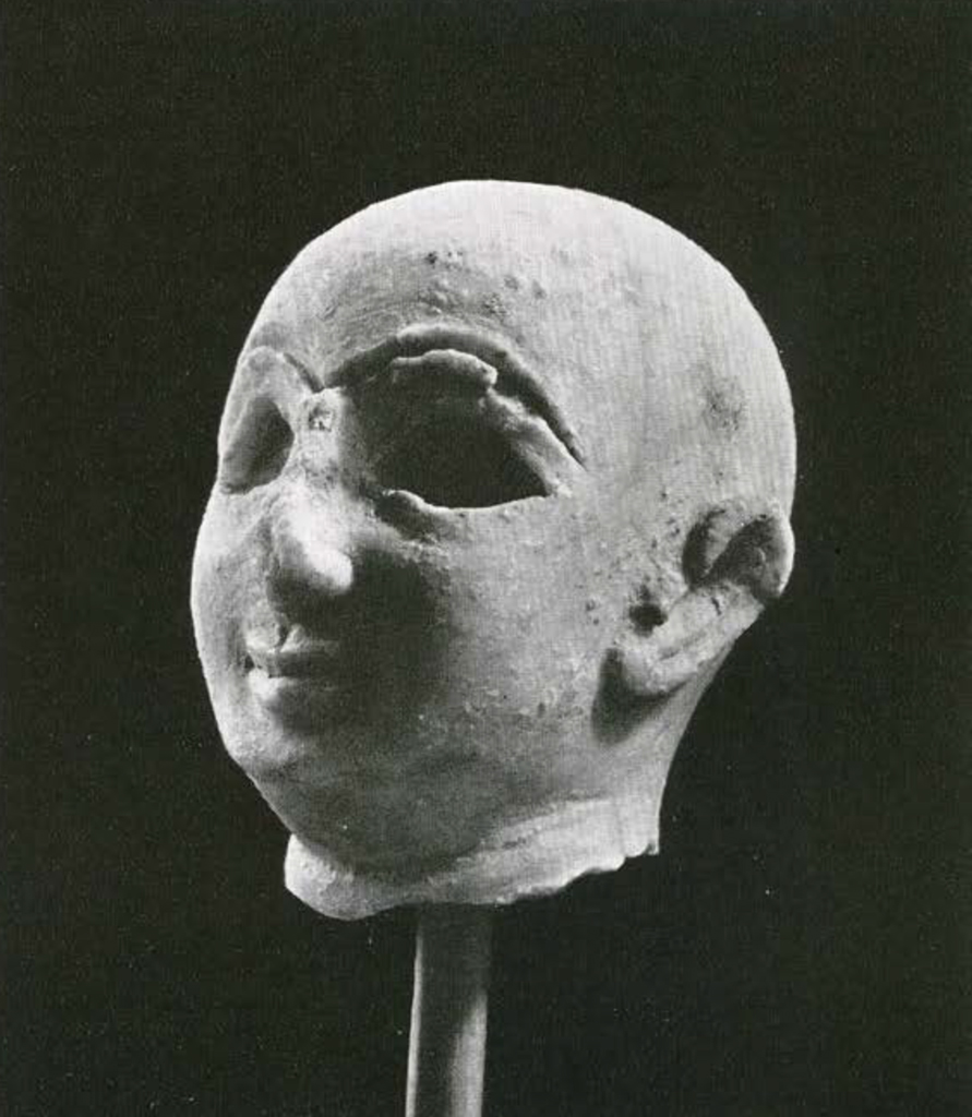 Head of a statuette with incised eyes and eyebrows, both eye sockets empty