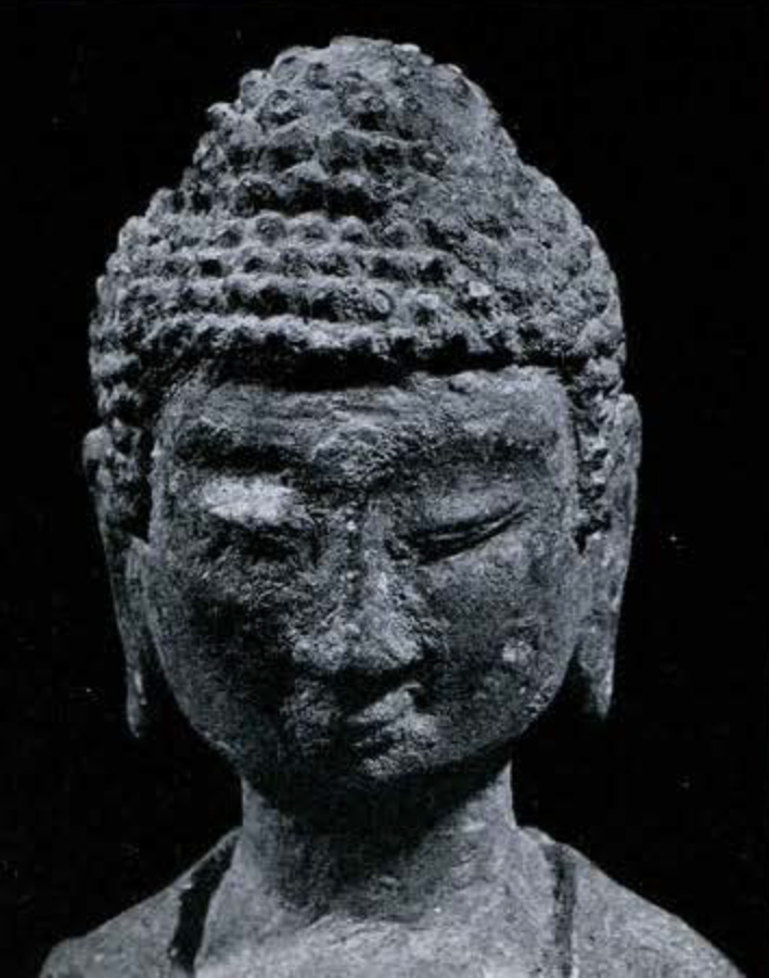 Bronze figure of Amitabha with long ears, and tightly curled hair of Indian type, shoulders up view