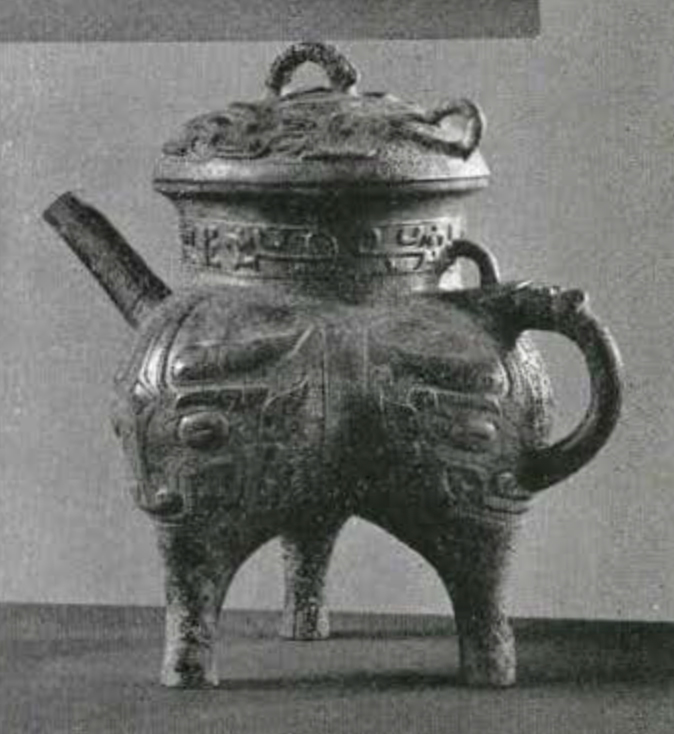Tripod vessel in the shape of a teapot