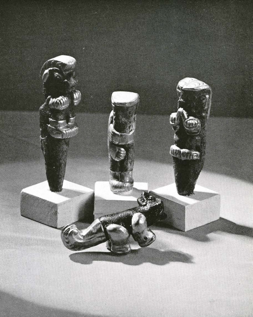 Three figurines made of whale teeth with gold inlay on the feet and heads or tails