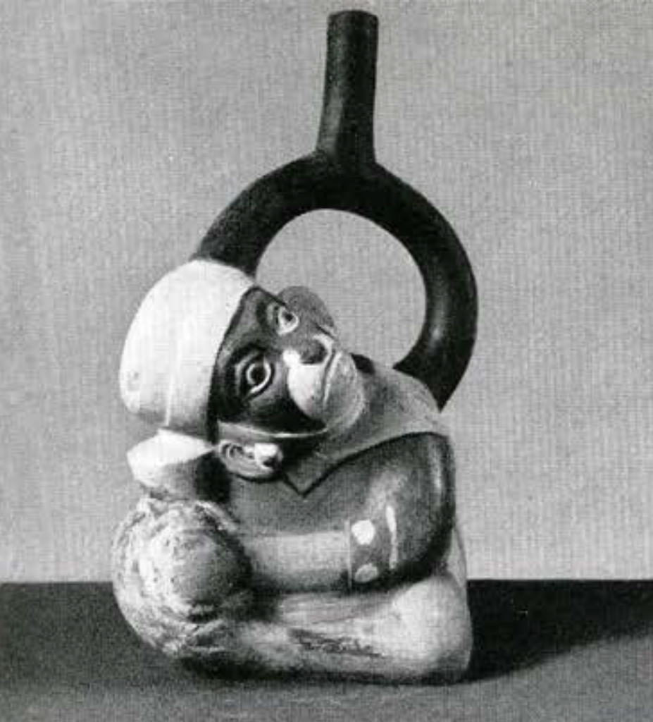 Stirrup spout effigy vessel in the shape of a monkey headed man listening to a jar