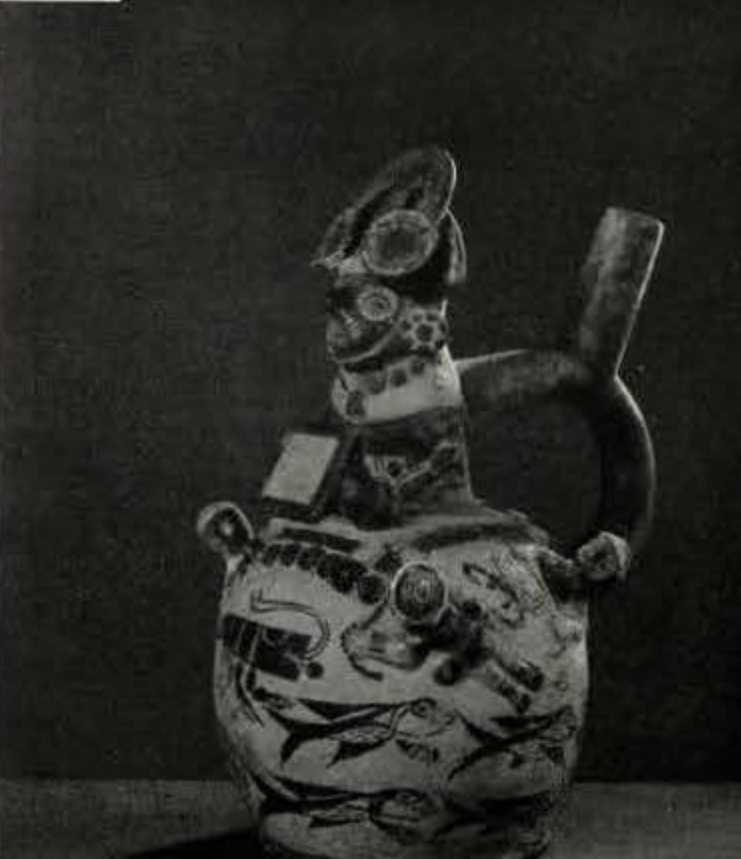 Stirrup spouted effigy vessel with a painted body and a warrior decorating the neck