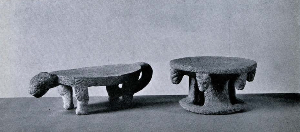 Two metates, one in the shape of a jaguar and the other with six jaguar heads decorating it