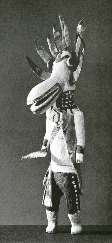 Katchina doll with head in the shape of a bird, decorated with metal feathers