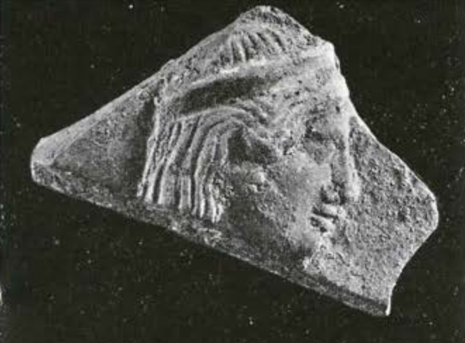 Fragment of a plaque showing a head