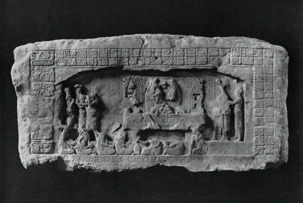 Carved stone lintel depicting a religious ceremony