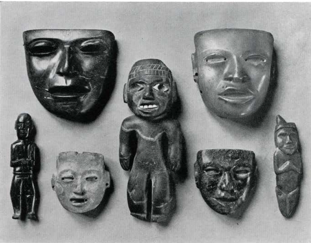 Four stone masks and three stone figures