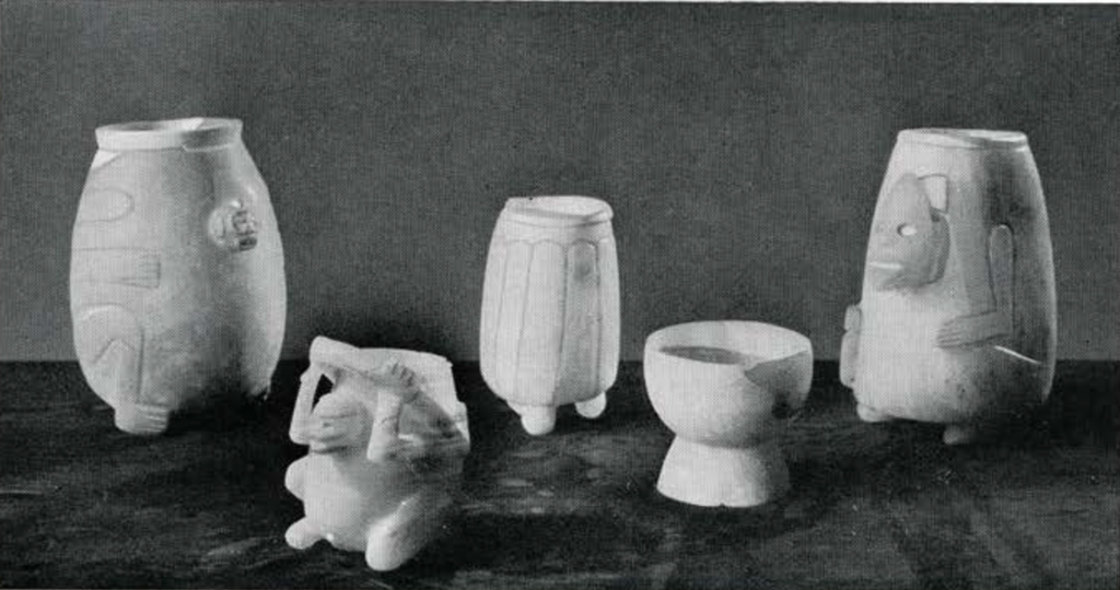 Four alabaster vases, decorated with human physical characteristics, and one alabaster cups
