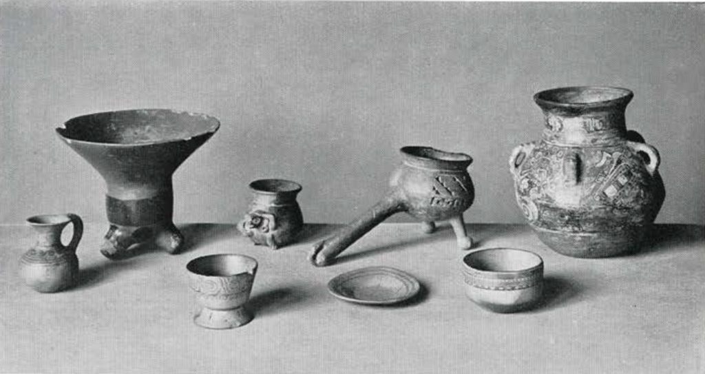 Pottery vessels in an assortment of shapes including cups, bowls, and vases