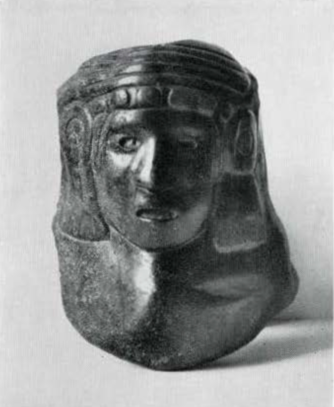 Polished carved stone head of an Aztec goddess
