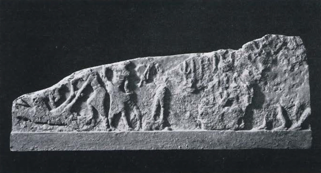 Fragments of a stela showing a ritual sacrifice