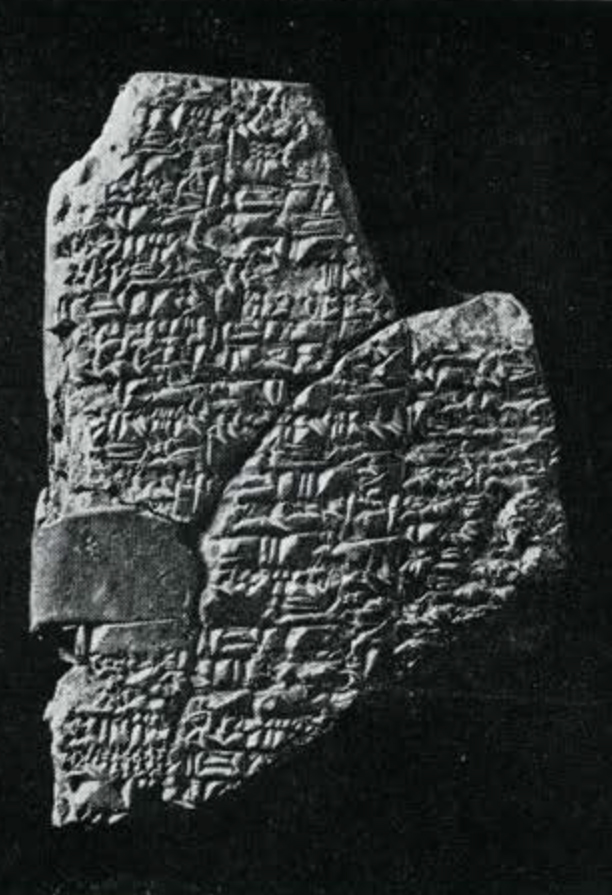 Pieces of a tablet pieced together, inscribed in cuneiform