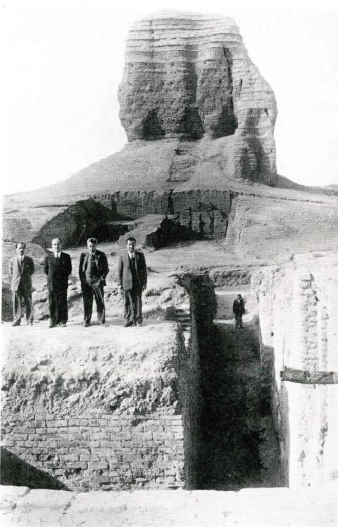 Ziggurat at Agar Quf showing Dr. Samuel N. Kramer with a group of Iraqi men.
