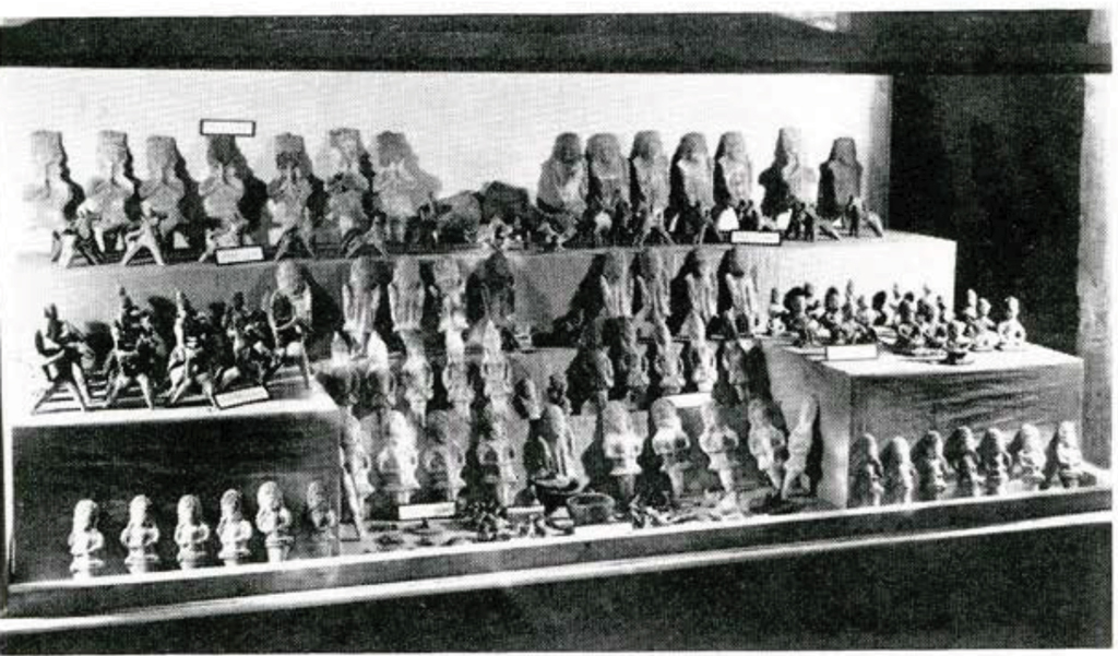 Sveral shelves showing a toy collection of figurines of warriors and soldiers.