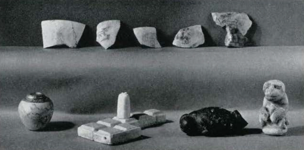 An assortment of objects from Abydos, including pottery fragments with inscriptions, a bot, a game board, and animal scultpures.