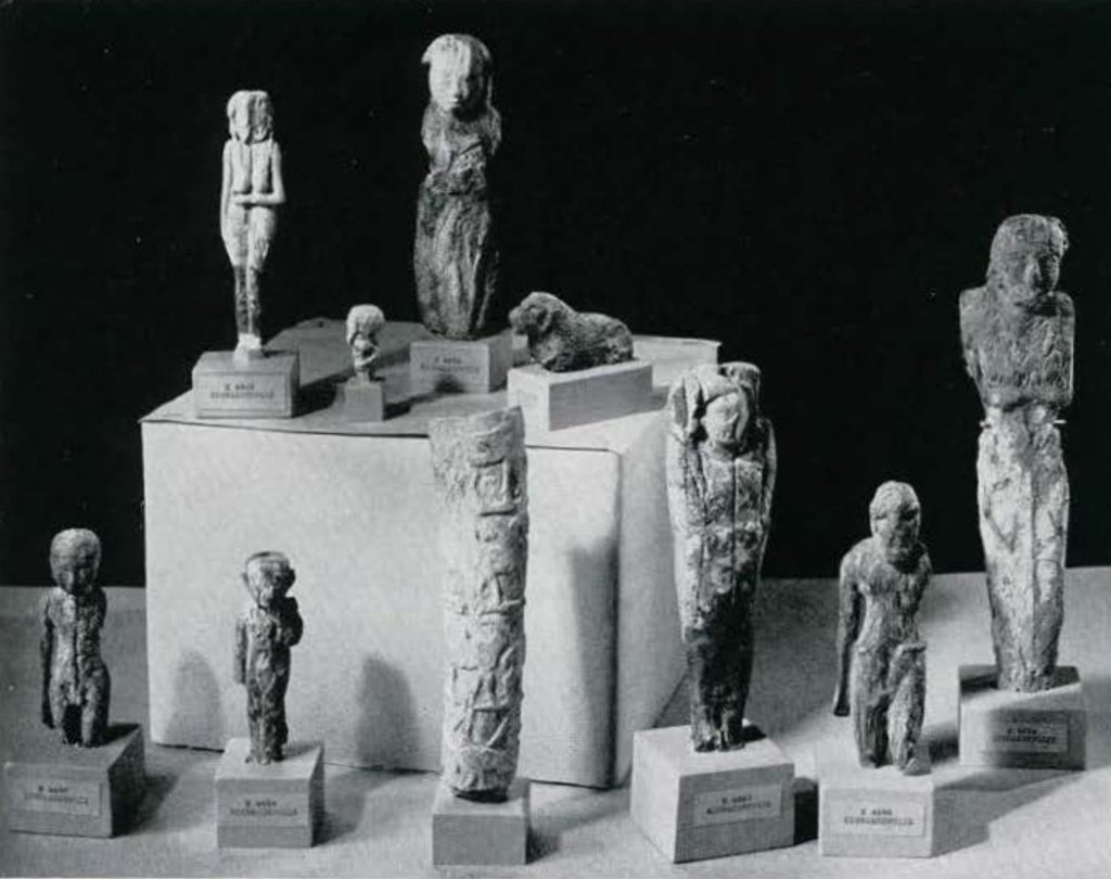 Worn ivory figurines of people and an animal.