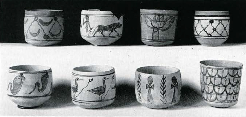 Eight painted cups with repeated patterns of animals or plants.