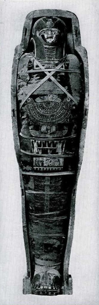 A wrapped mummy resting in a coffin.