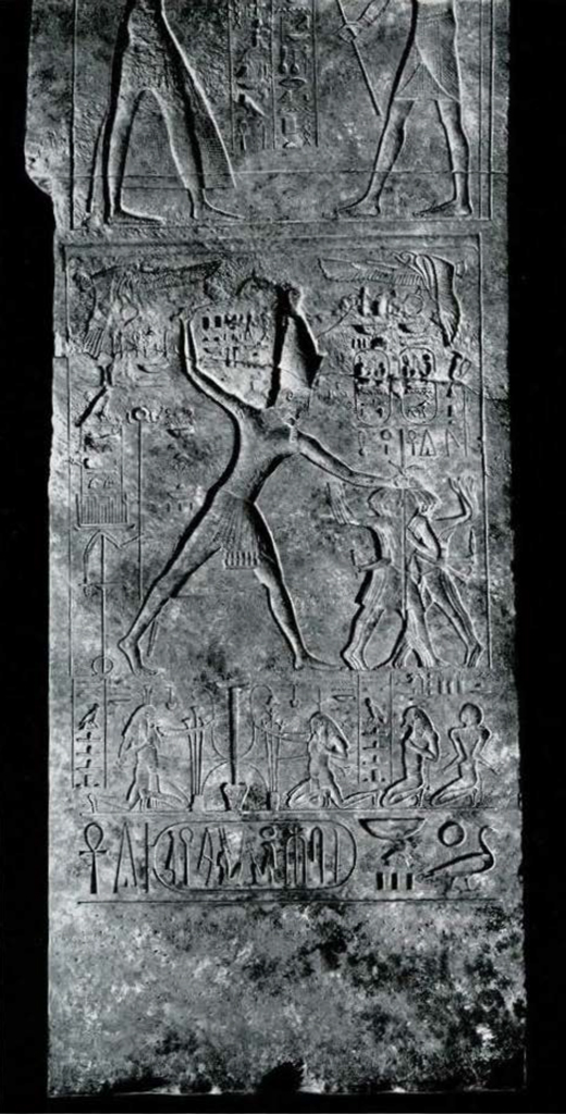Relief showing an Egyptian beating his enemies.