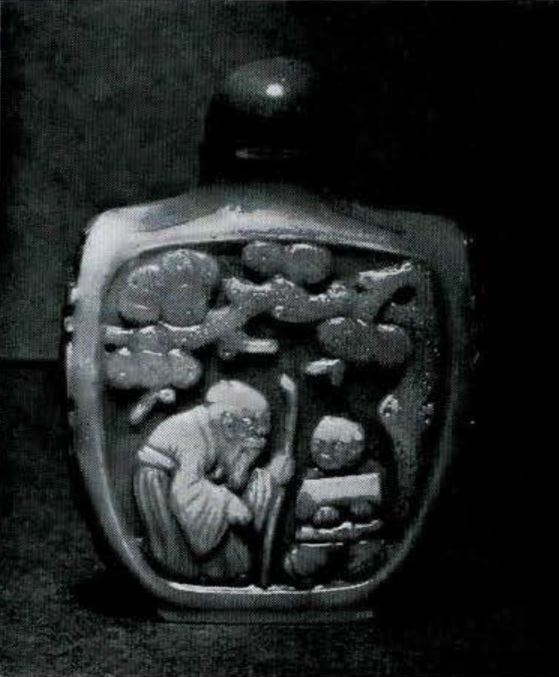 Snuff bottle with a hunched old man carved into it.