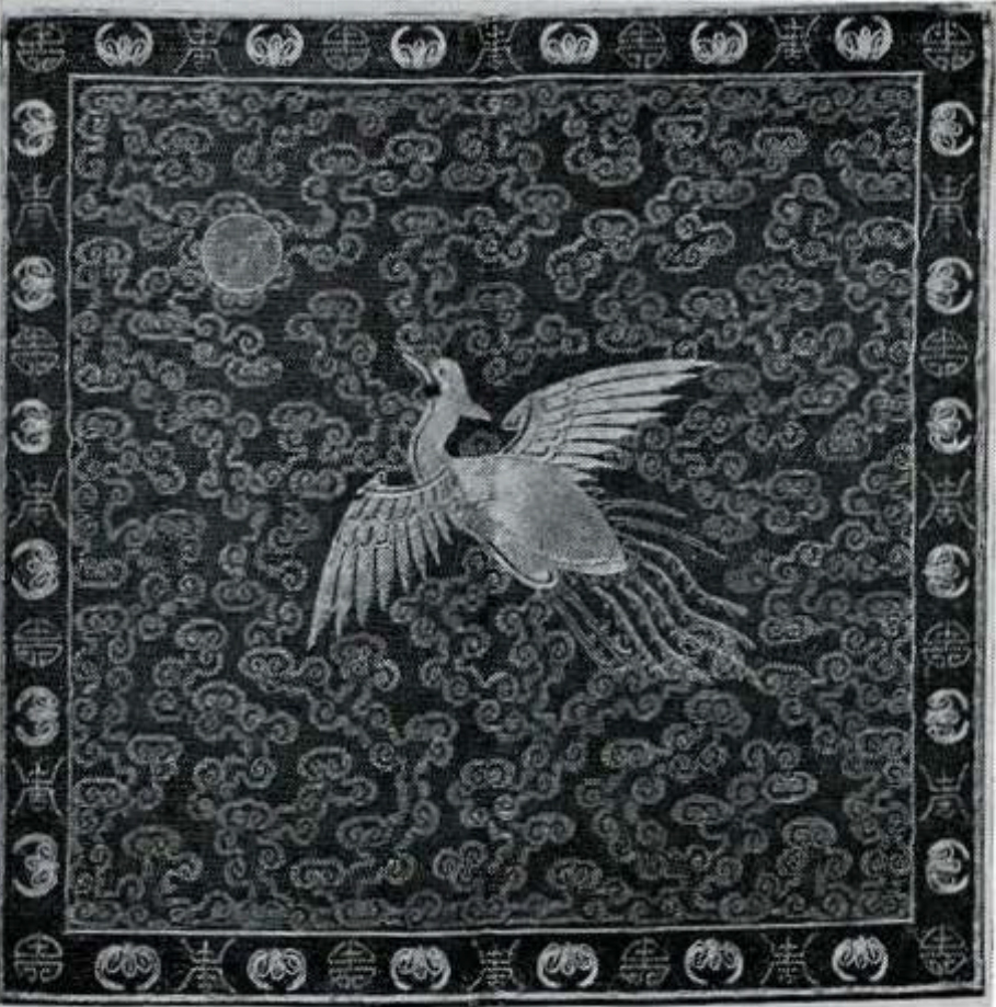 Mandarin square of a silver pheasant flying to the moon, among scrolling clouds.