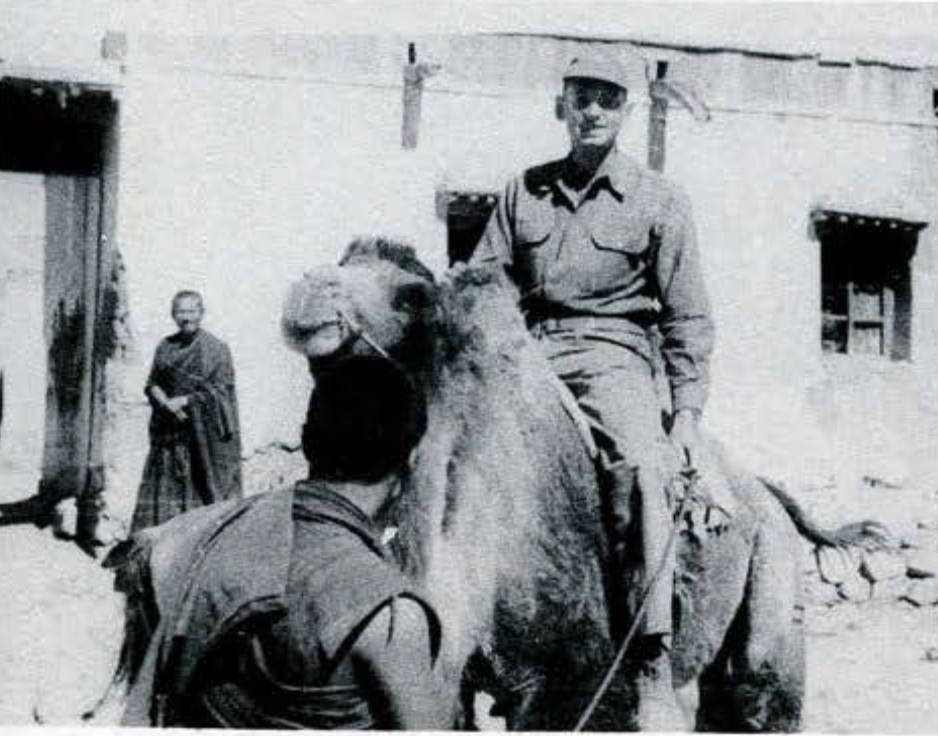 Schuyler Cammann on the back of a camel.