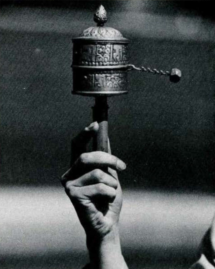 A prayer wheel being turned.