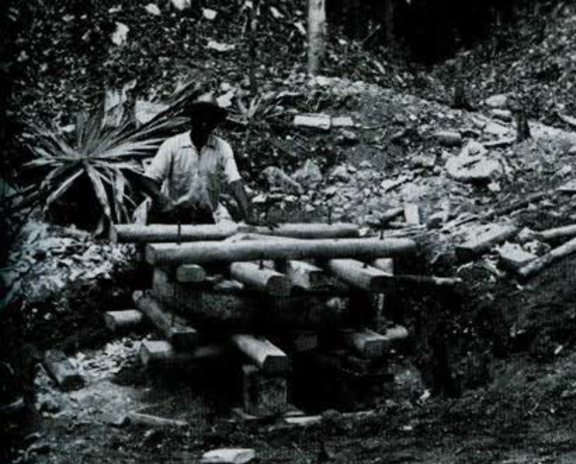 A man working on a wooden crate.