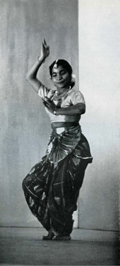 A woman performing a Hindu dance.