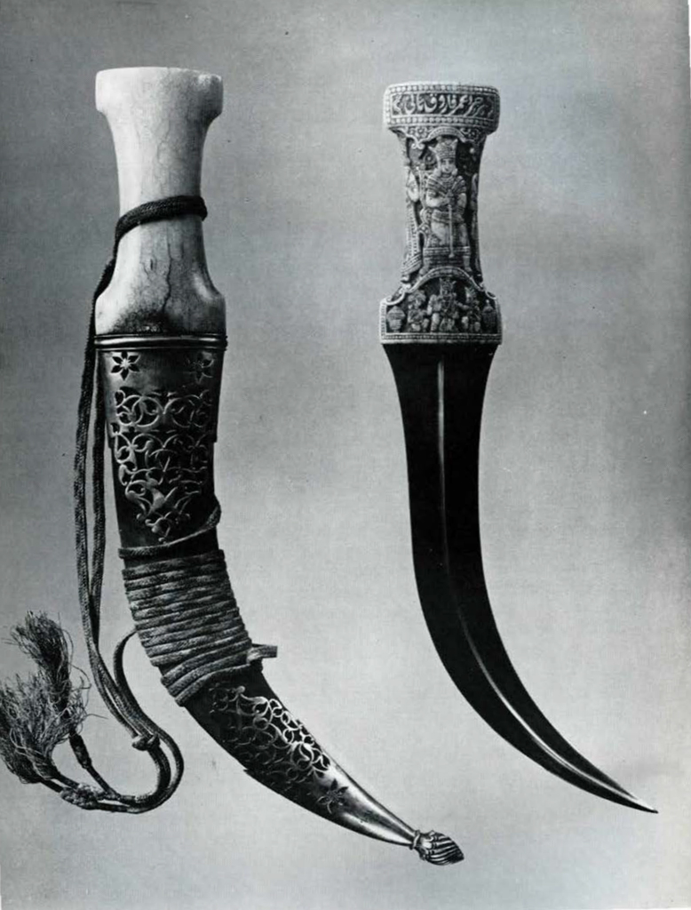 Two daggers, one sheathed, the unsheathed has an ornately carved.