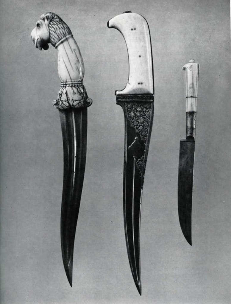 Three daggers with ivory hilts, one hilt in the shape of a camel head.