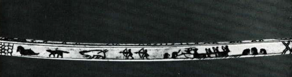 A drill bow with a hunting scene carved into it.