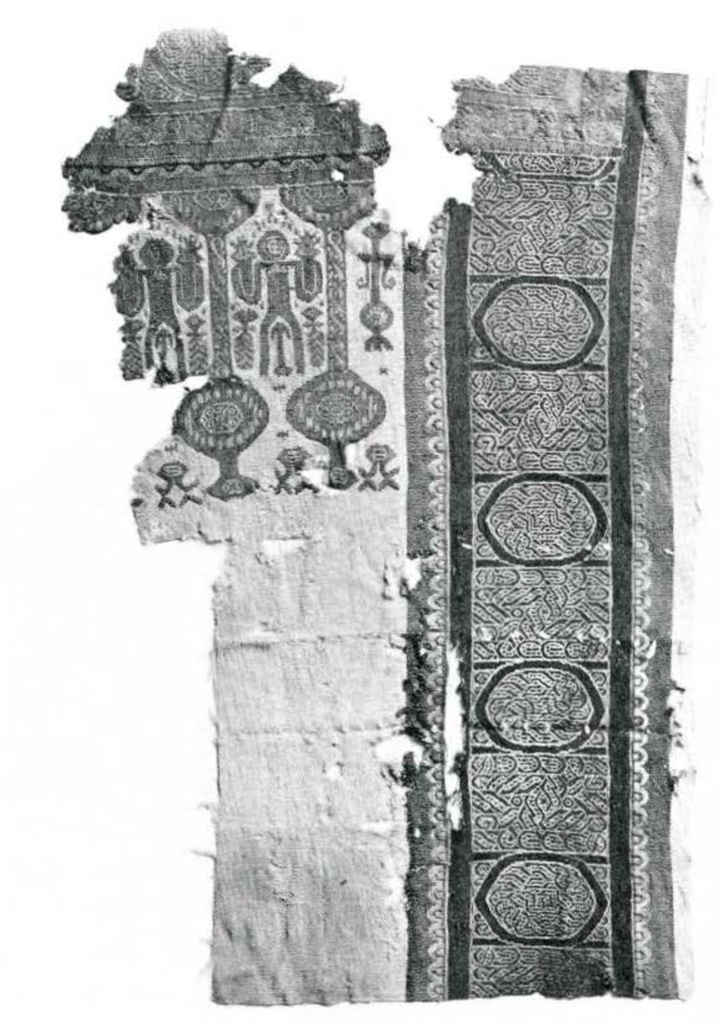 A fragment of a copitc textile with a intricate interlocking design running vertically on the right side and a design sowing people on the right.