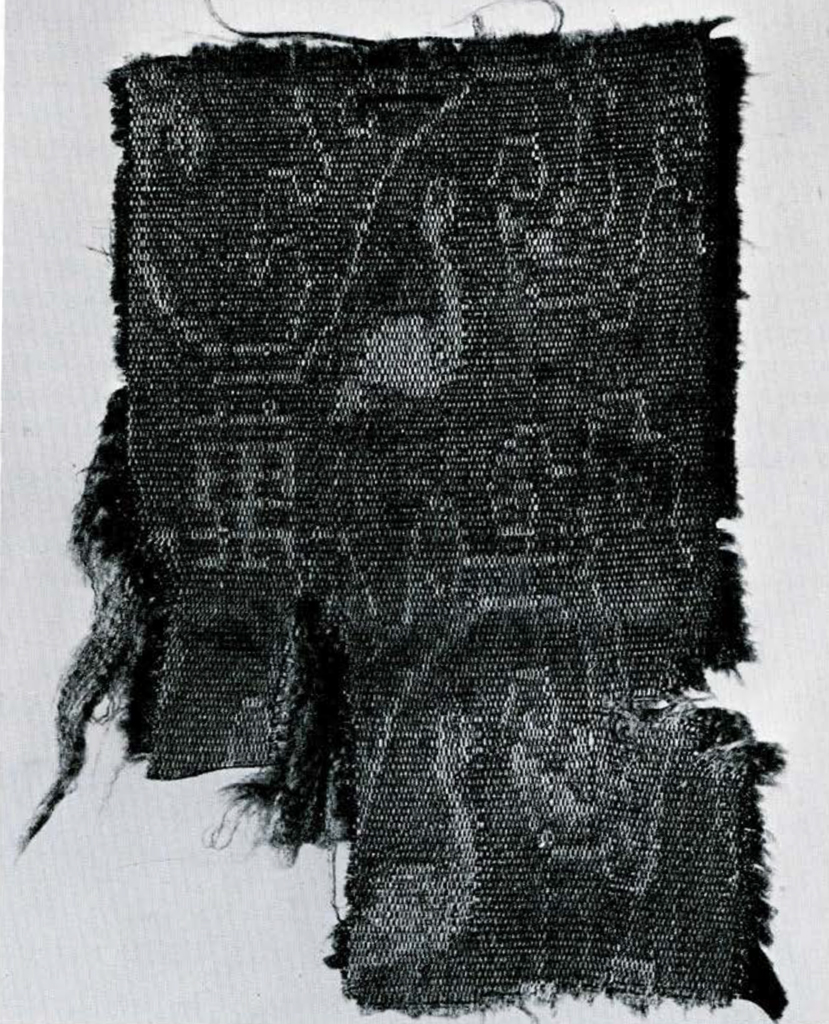 Portion of silk cloth with heron and Chinese characters.
