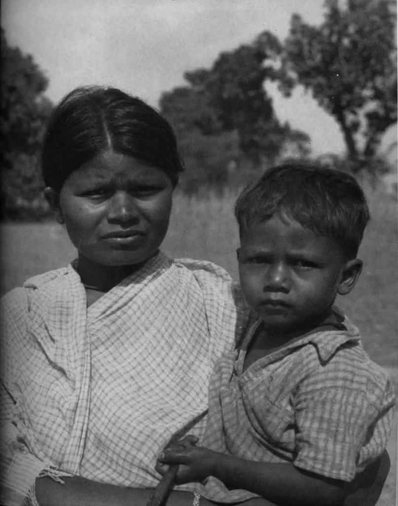 Portrait of a woman holding a boy.