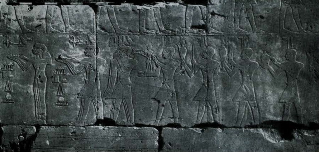 Relief of a pocession of priests carying offerings and censers.