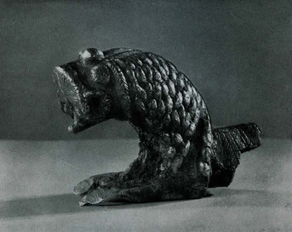 A cast bronze lion fragment.
