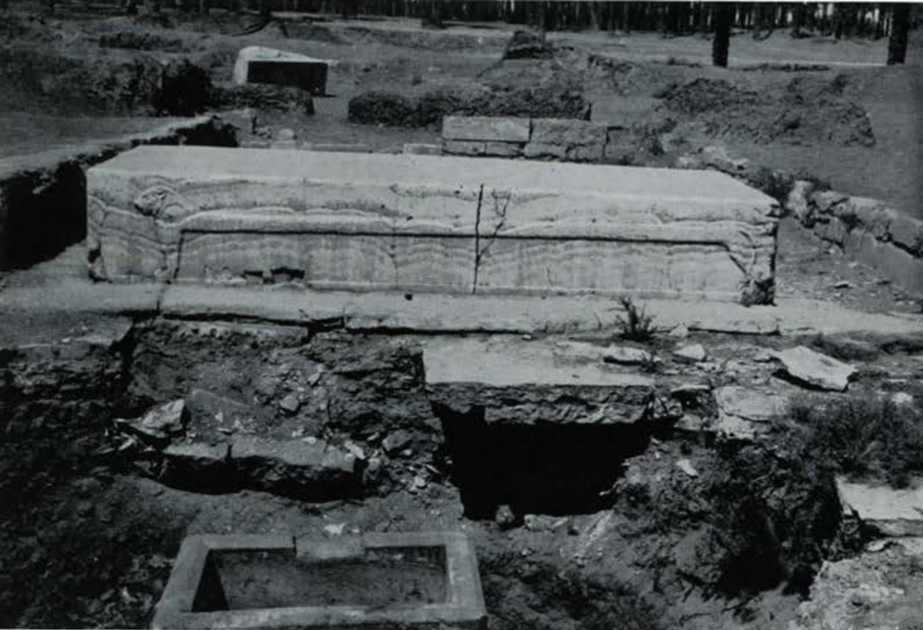 A large table used for embaling, amongst an excavation pit.