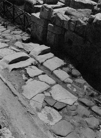 Cracked pavement stones on an ancient road.