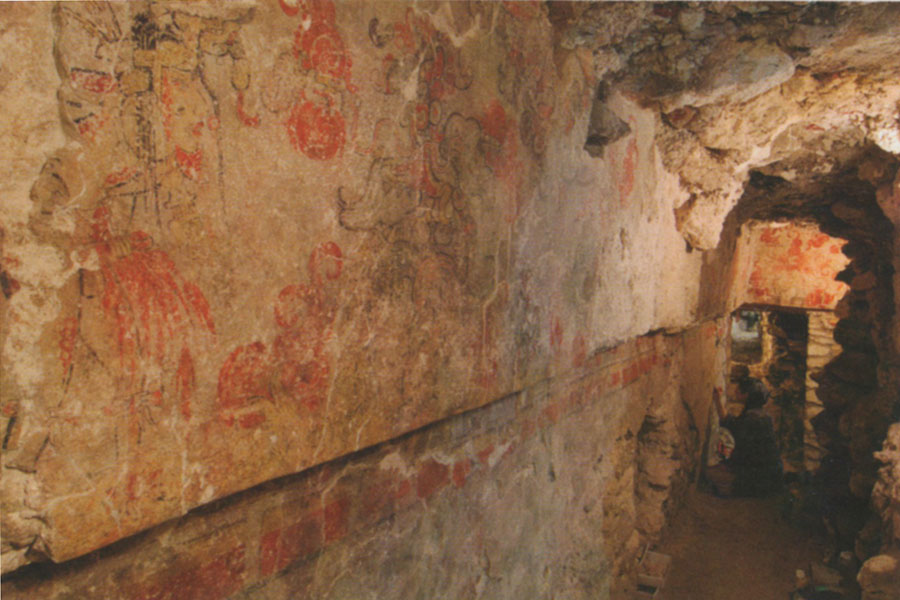 Mayan murals depicting the creation myth in red paint.