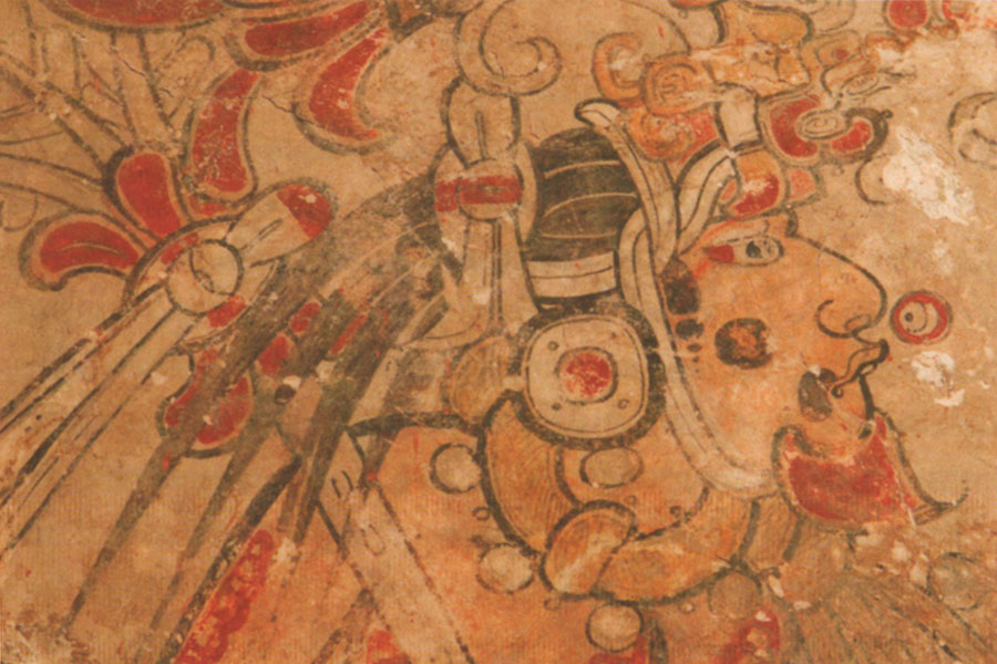 Close up of section of a mural depicting a Mayan king wearing an elaborate headdress.
